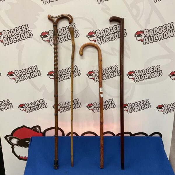 Lot of four vintage walking sticks and canes for collectors.