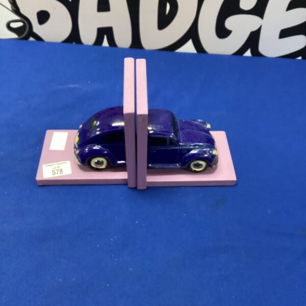 Vintage VW Beetle bookends for collectible car decor.