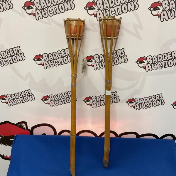 Two bamboo tiki candle holders for garden lighting.
