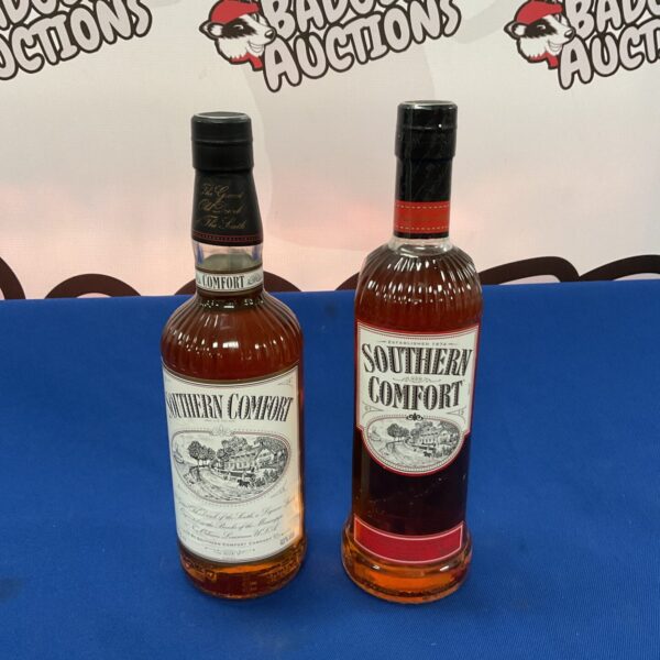 Two sealed bottles of Southern Comfort whiskey liqueur.