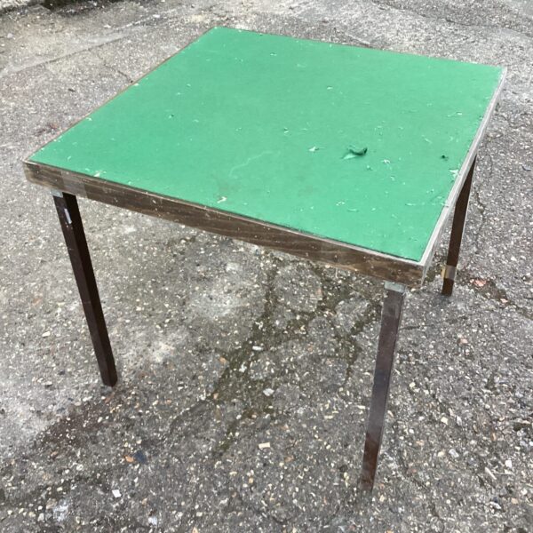 Vintage green folding card table for games and portable use.