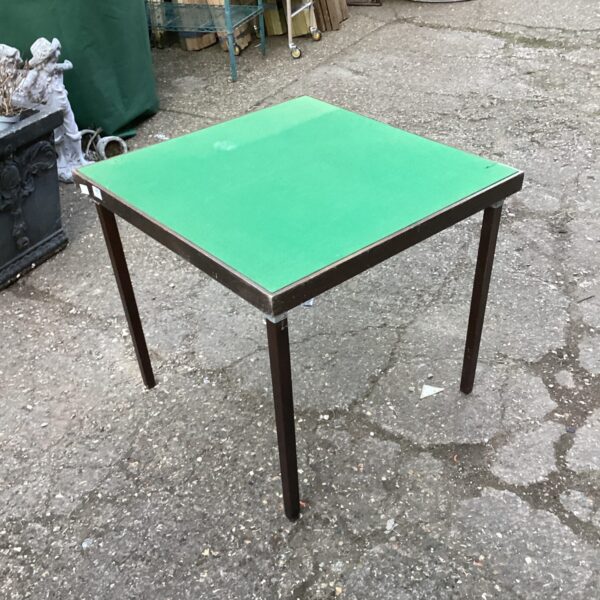 Vintage green folding card table for game nights.