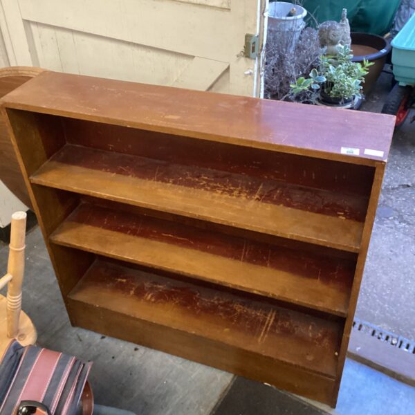 Vintage oak bookshelf with a classic design for home storage.