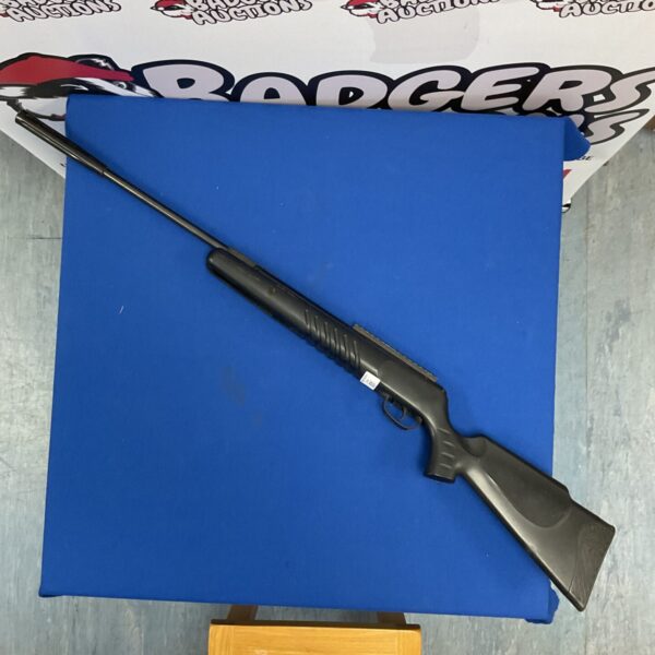 Crosman Nitro Venom air rifle on blue backdrop.