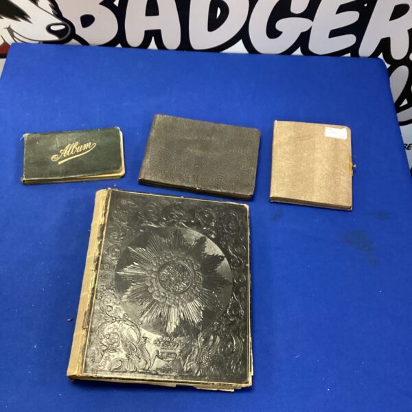 Antique leather bound sketchbook with embossed cover detail.