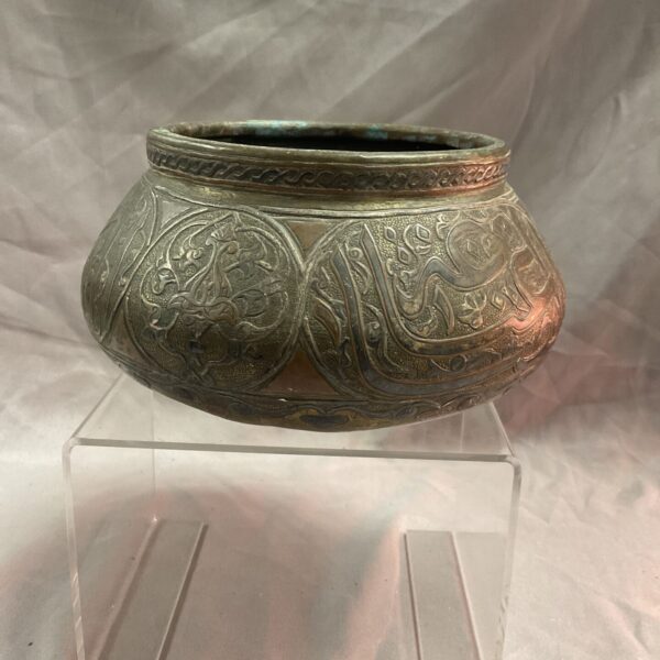 Antique Damascus brass bowl with intricate floral and geometric copper and silver inlay.