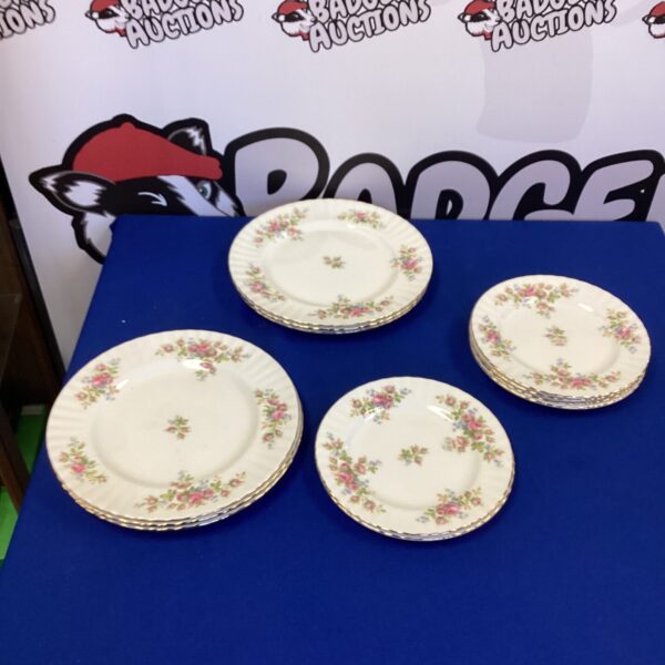 Royal Albert Moss Rose china plates with floral design.
