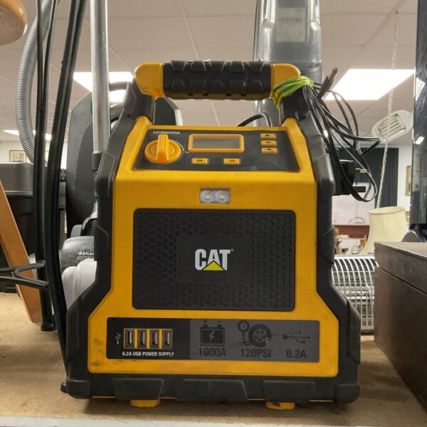 Cat cj1000cpuk power supply with USB ports and AC outlet.