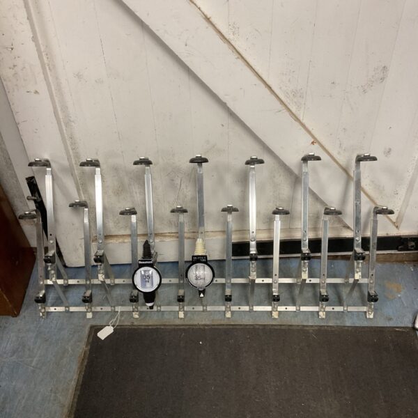 Large set of stainless steel bar optics for accurate liquor measures.