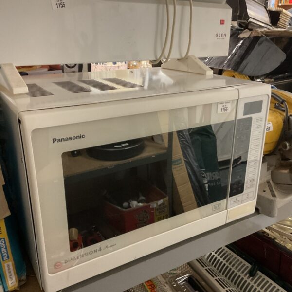 Vintage Panasonic Dimension 4 microwave appliance in a kitchen setting.