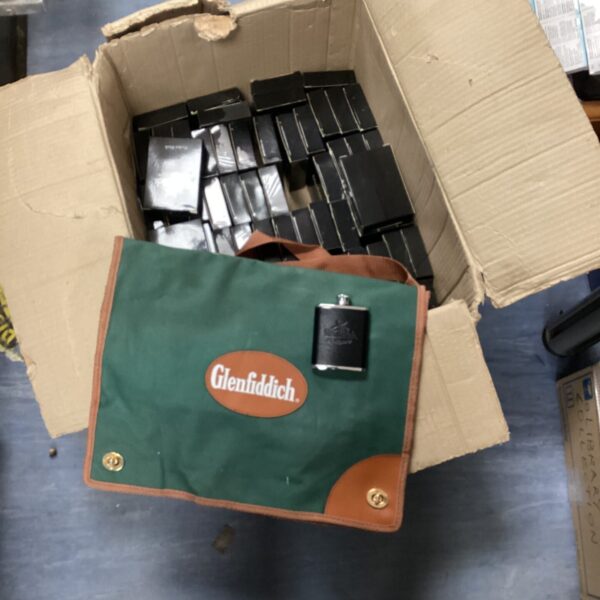Glenfiddich branded drawstring bag with a large quantity of pocket flasks.
