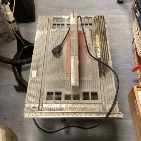 Front view of a used electric table saw for woodworking.