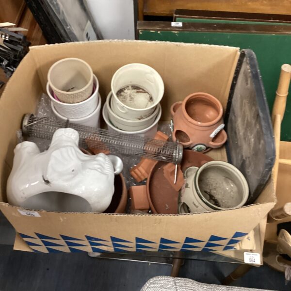 Assorted plant pots and planters including terracotta and an elephant planter.