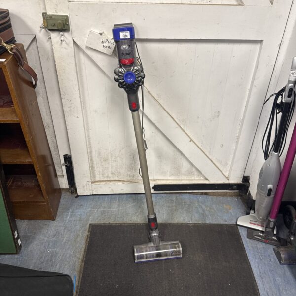 Dyson V8 Animal cordless vacuum cleaner in a home setting.