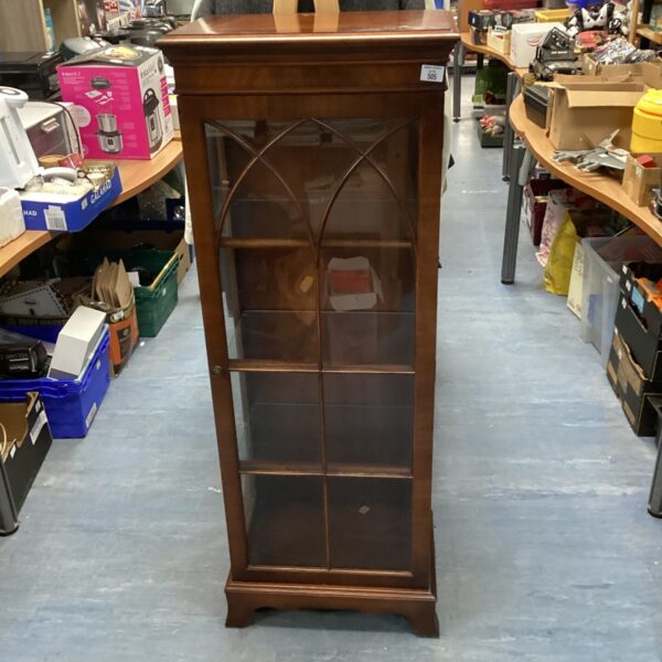 Vintage mahogany gothic display cabinet with glass shelves.