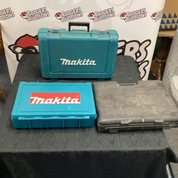 Lot of three blue Makita toolboxes for tool storage.