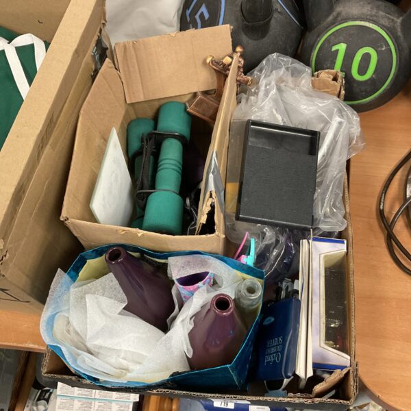 Mixed lot of fitness weights and sports trophies for collectors.