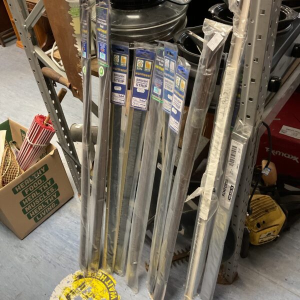 Lot of new Warmseal door brush seals for draft exclusion.