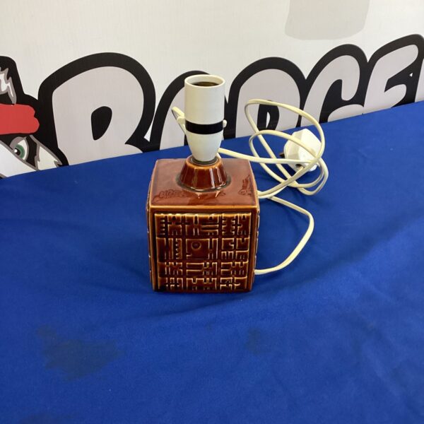 Vintage Poole Pottery table lamp with textured ceramic base.