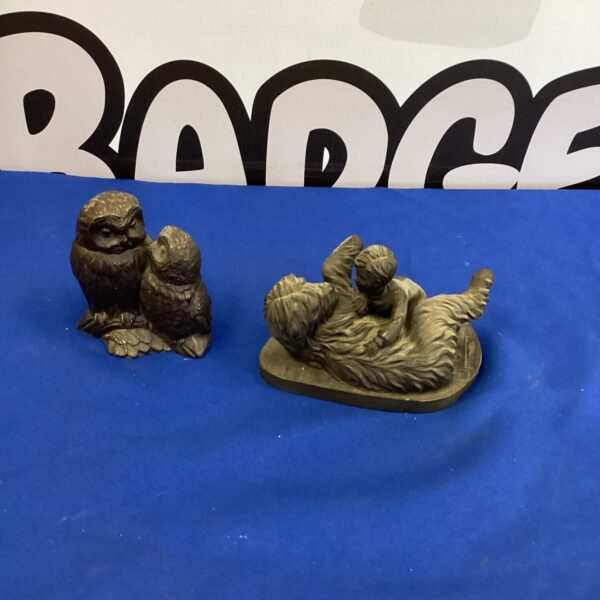Detailed resin figures of a boy and his dog for home decor.