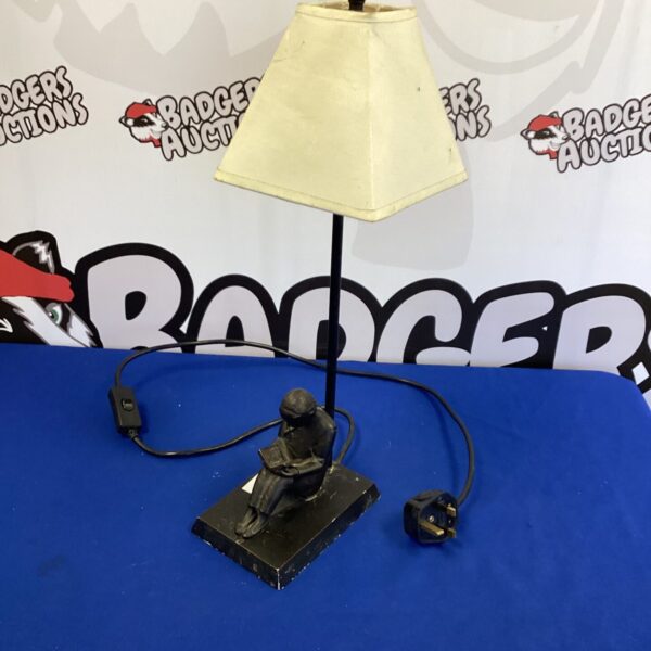 Vintage cast metal table lamp with girl reading sculpture.