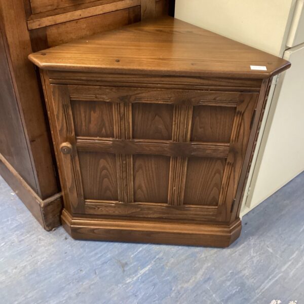Vintage Ercol corner unit with lattice door, mid century modern style.