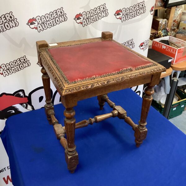Antique leather topped oak stool with tripod legs.