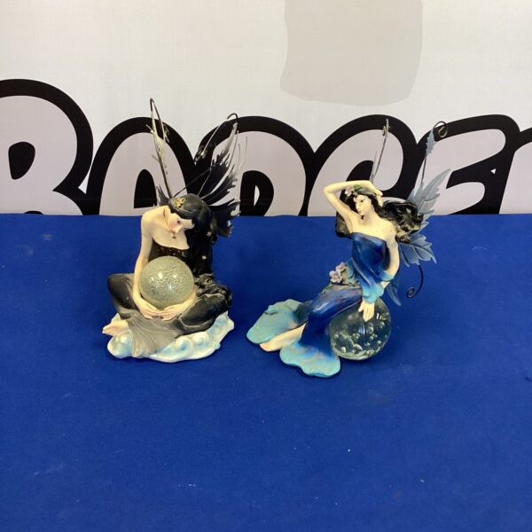 Pair of detailed night fairy figurines for collectors and home decor.