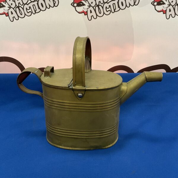 Vintage brass Army & Navy watering can with patina.