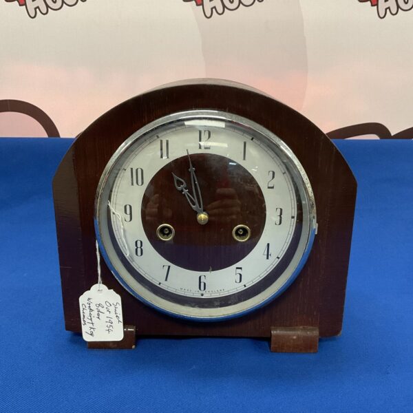 Vintage Smiths October 1954 mantle clock with chiming mechanism.