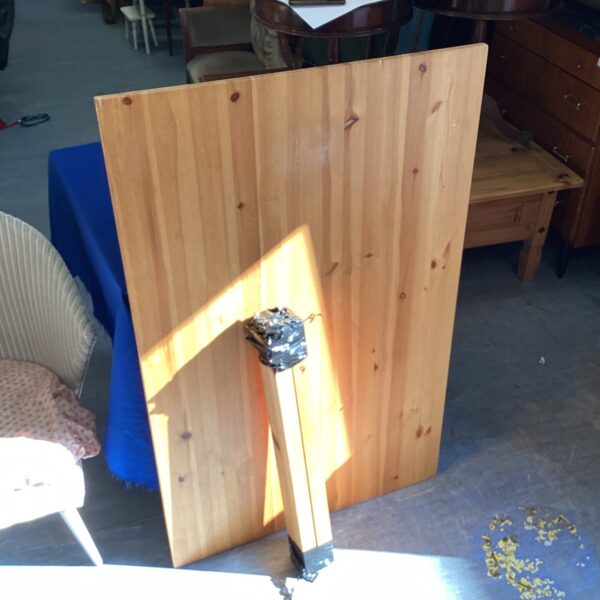 Rustic pine dining table measuring 47 x 30 inches.