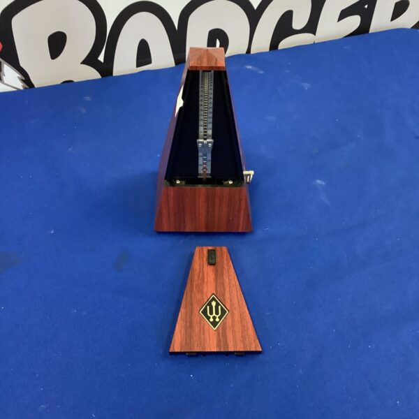 Vintage Wittner metronome with wooden casing for musical timing.