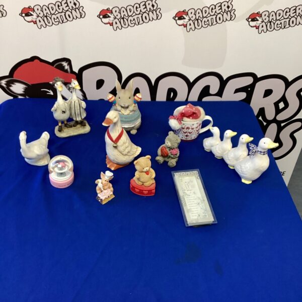 Collection of porcelain duck figurines for collectors.