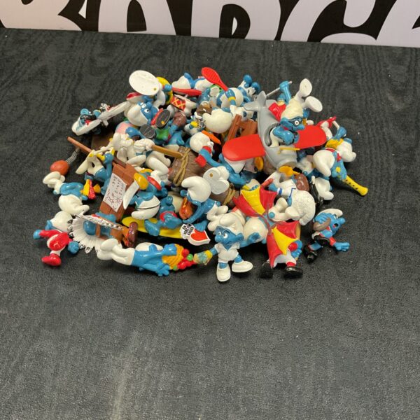 Large lot of vintage Schleich Smurf figurines for collectors.