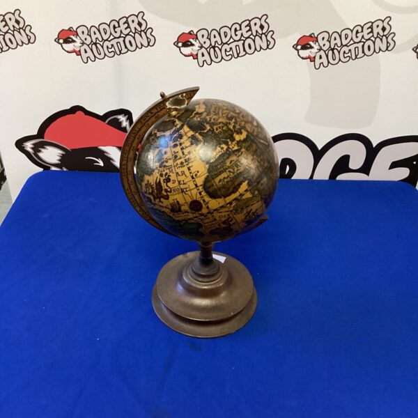 Detailed vintage globe on a wooden base, antique cartography.