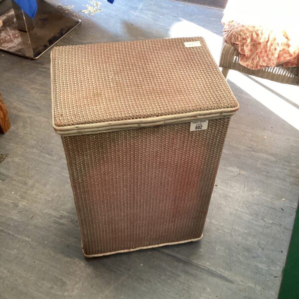 Vintage Lloyd Loom wash bin for laundry or linen storage.