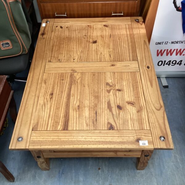 Large rustic pine coffee table with a solid wood construction.