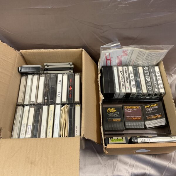 Vintage Atari games lot with cassette and cartridge titles.
