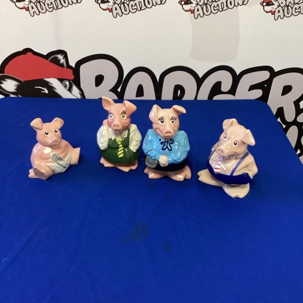 Set of four vintage NatWest Wade piggy banks.