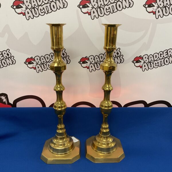 Pair of vintage brass candlesticks, 19 inches tall, for home decor.