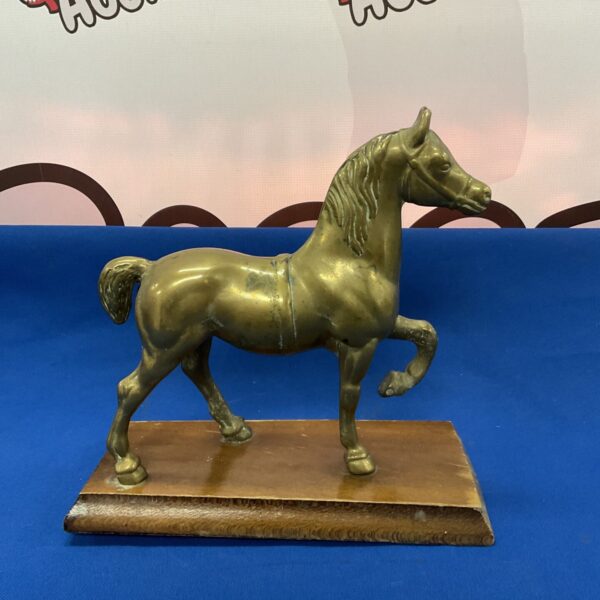 Vintage mid-century brass horse sculpture with patina.