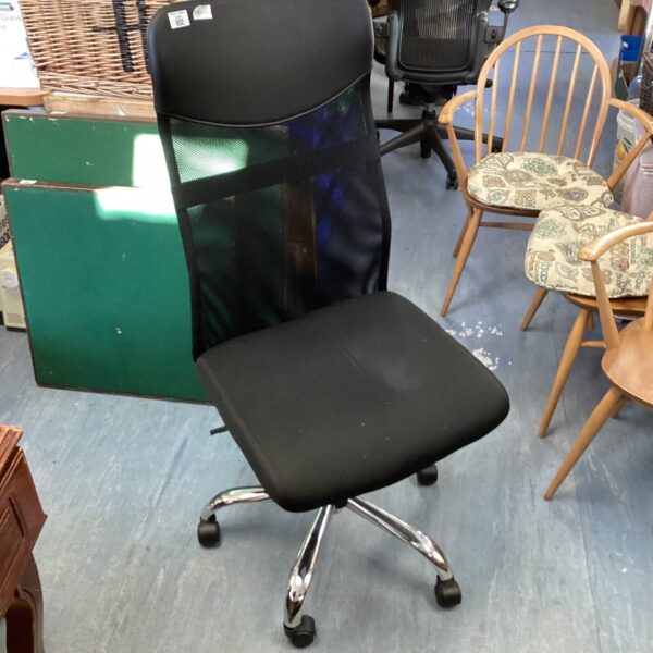 Black office swivel chair with mesh back and castors.