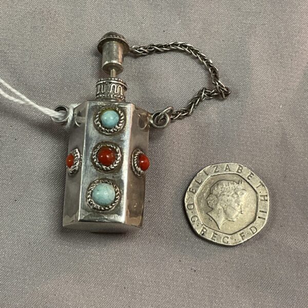Antique silver snuff bottle pendant with semi-precious stones.