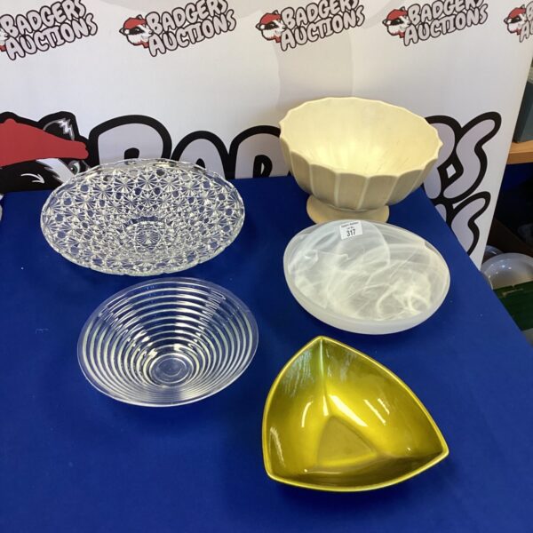 Selection of vintage glass fruit bowls on display.