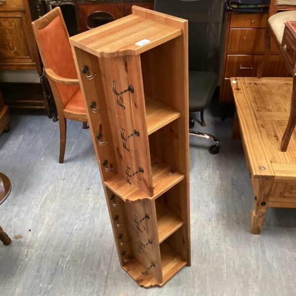Vintage pine coat rack with multiple hooks for hallway storage.