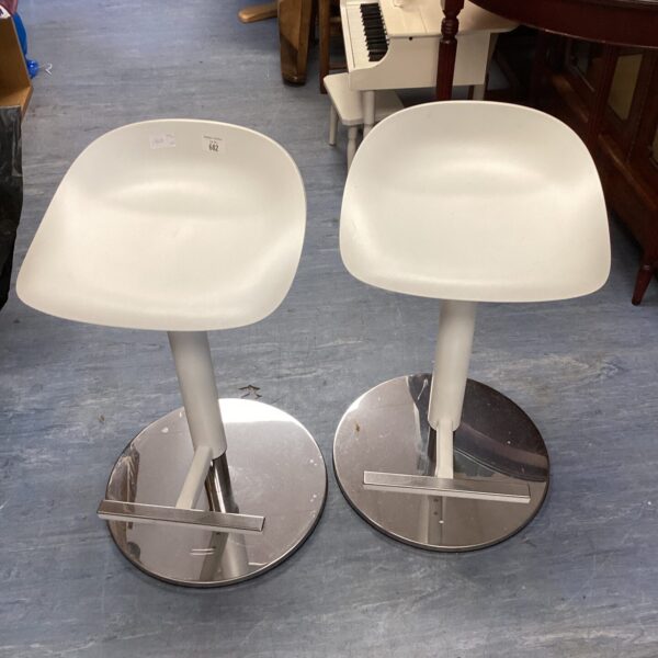 Pair of white and chrome bar stools for kitchen counters.