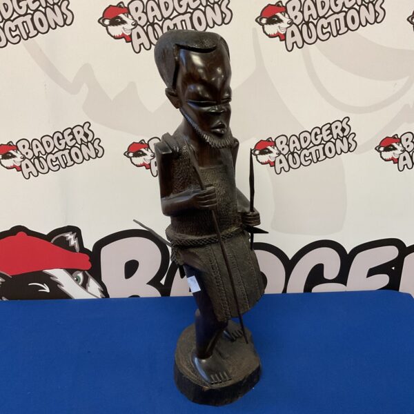 Vintage African tribal huntsman sculpture carved from hardwood.