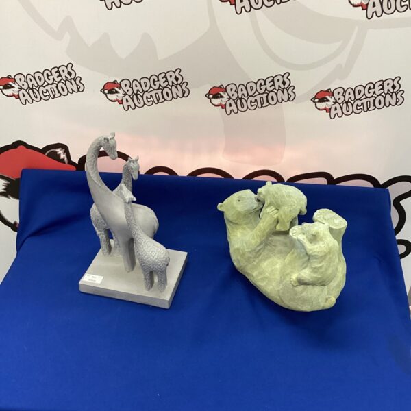 Detailed resin giraffe and zebra figurines for home decor.