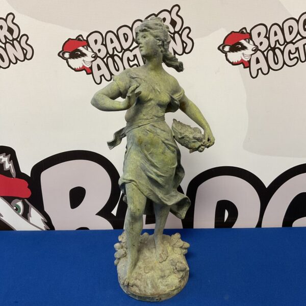 Vintage spelter flower girl statue with detailed base.