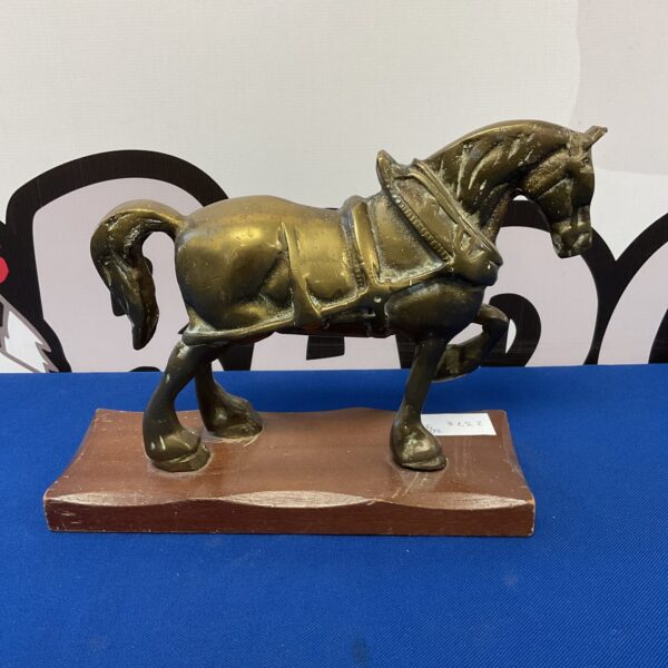 Detailed vintage brass Shire horse sculpture on wooden base.